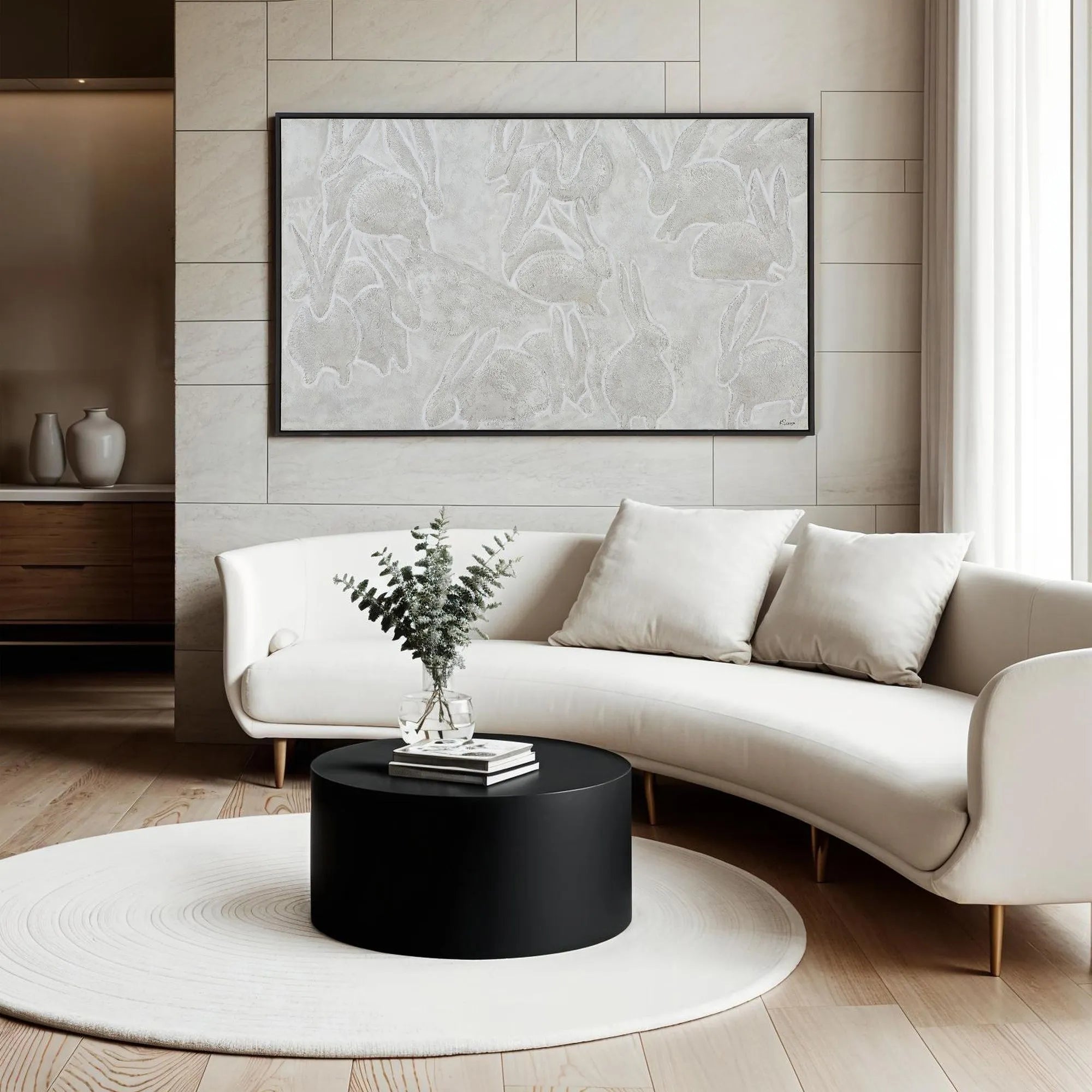 Lacey Wall Art by Ksenia Sizaya 
Modern living room with a white sofa, black coffee table, and abstract art on the wall.